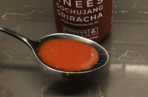 Weak Knees Gochujang Sriracha Hot Sauce_in spoon