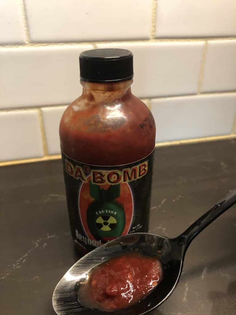 Da Bomb Beyond Insanity hot sauce on spoon