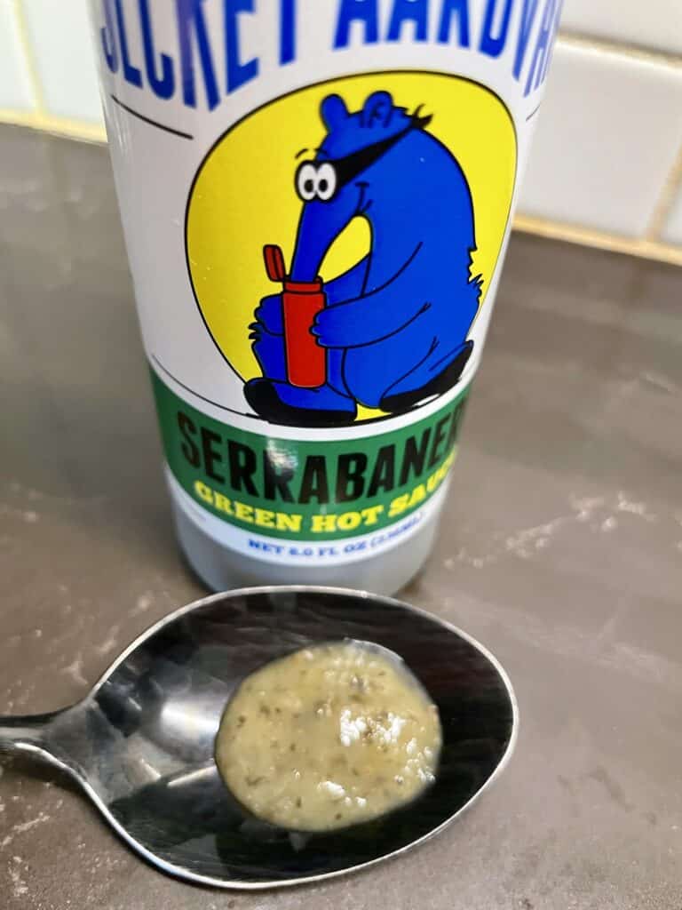 Secret Aardvark Serrabanero Green Hot Sauce on a spoon