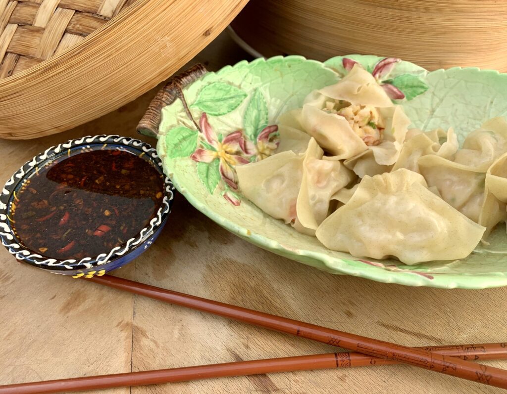 Steamed shrimp dumplings with fiery dipping sauce