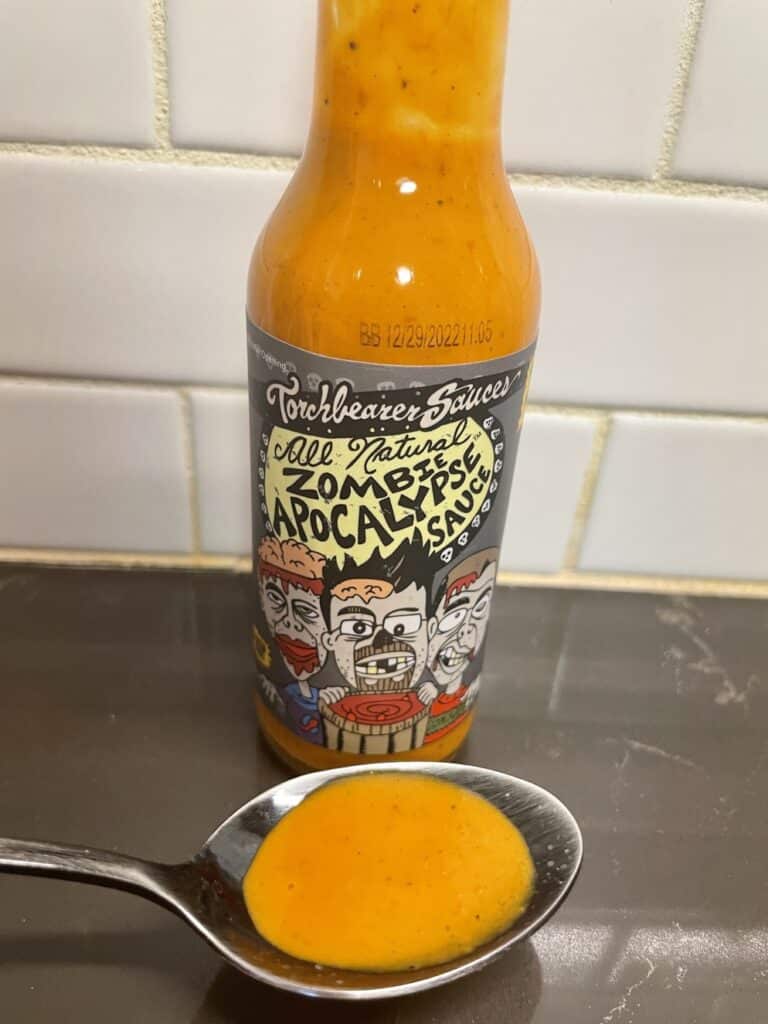 Torchbearer Zombie Apocalypse Hot Sauce on a spoon
