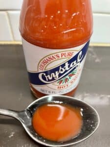 Crystal Hot Sauce on a spoon